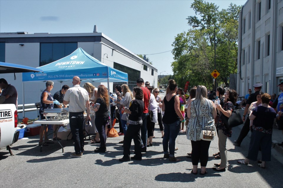 A few dozen people gather on Evergreen street in the dowtown core for this years Pride barbecue where there was food for sale and entertainment provided by Sudbury Youth Rocks. (Annie Duncan/Sudbury.com)