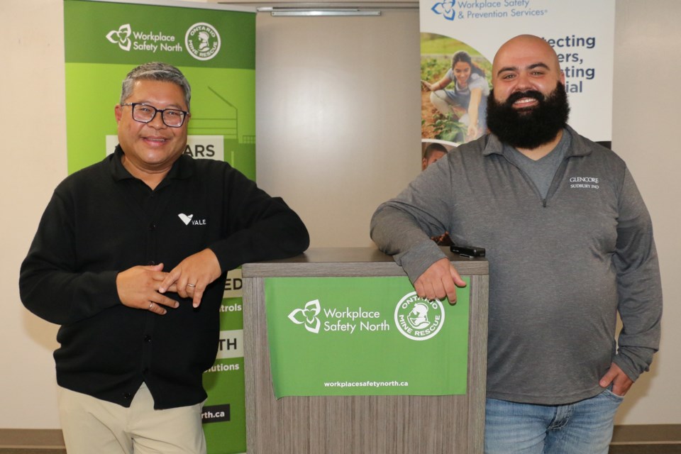 Raffy Tiangco, left, of Vale in Sudbury works regularly with Shawn Sauvé of Glencore in Sudbury, as they combined their efforts to work with manufacturing companies and other mining companies to develop the safest of most efficient battery-electric vehicles for underground mining. The two men were speakers at a mining safety symposium held in Sudbury on Sept 11. 