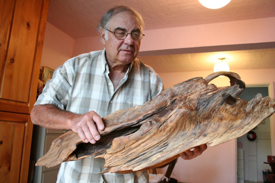 In 2008, Ron Romanko (shown in a 2009 file photo) found a treasure while picking blueberries. He believes the stump is 300 years old and is the remains of a majestic white pine tree. He worked on the  stump to uncover a beautiful sculpture.
