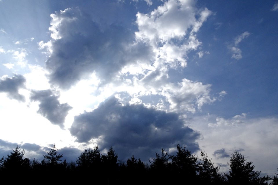 120522_linda derkacz big clouds with sun