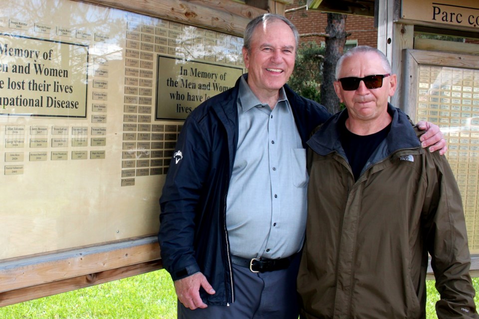 Daryl Park and Mike Leger are former Neelon Casting workers. They’re seen here in front of the memorial wall at Leo Gerard Memorial Park.