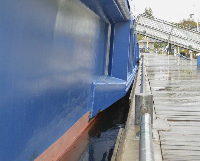 The fixed steel bumpers on the Victory I cruise ship caused damage to Little Current’s docks last week due to high Lake Huron water levels. (Alicia McCutcheon/Manitoulin Expositor)
