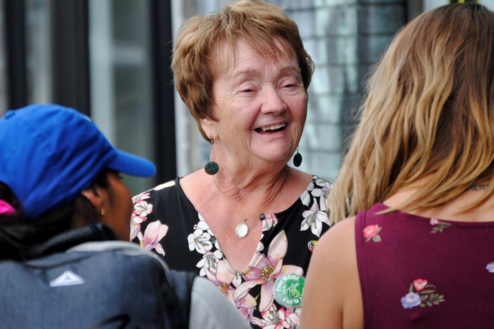 Greater Sudbury mayoral candidate Evelyn Dutrisac speaks to a member of the community on Elgin Street in downtown Sudbury today, shortly after the official opening of her campaign headquarters at 174 Elgin Street. 