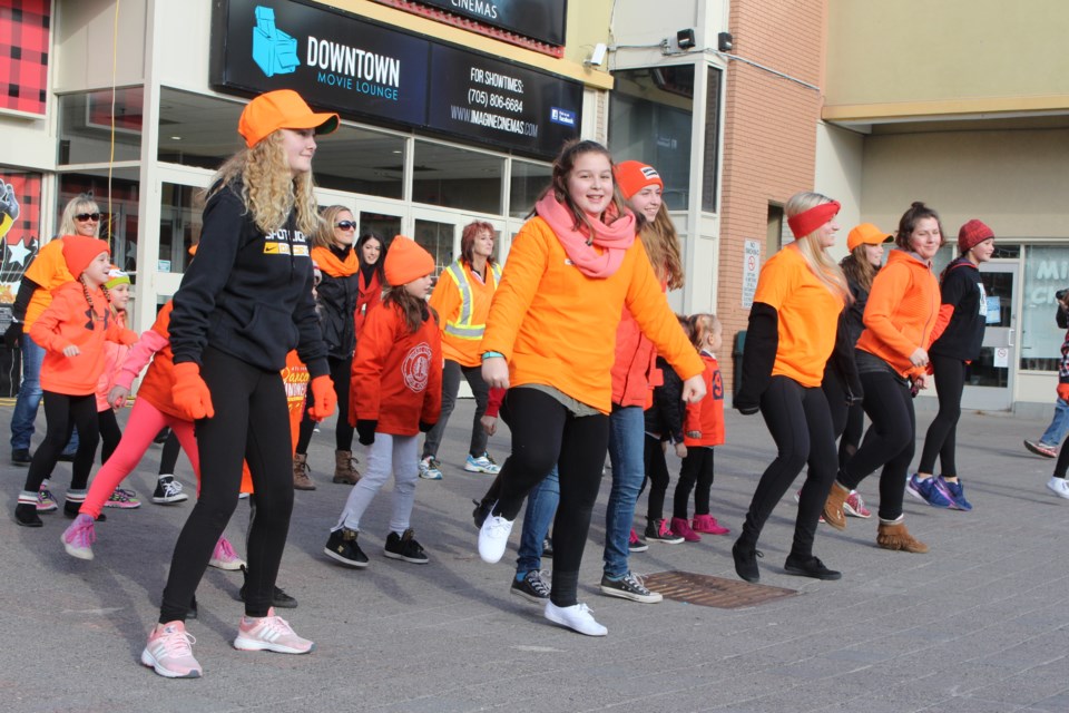 The Canadian Mental Health Association Subury/Manitoulin branch and members of the Spotlight Dance Company pit smiles on people’s faces in downtown Sudbury Sunday afternoon with a flash mob performance to celebrate World Kindness Day. Photo by Jonathan Migneault.
