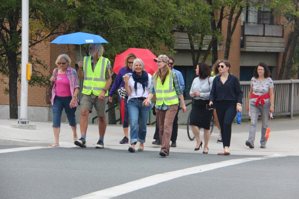 Participants in the Walk Sudbury project walked from Tom Davies Square to the Main Public Library Tuesday as part of the project's launch. Photo by Heidi Ulrichsen.