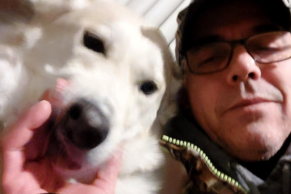 Sylvain Boissonneault is seen with Tinkerbell, his two-year-old husky, who infect him with the capnocytophaga bacteria that resulted in his death on June 8.