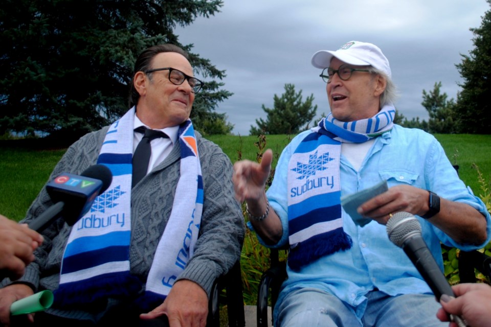 Actors Dan Aykroyd and Chevy Chase take questions from local media in Garson on Thursday evening while on the set of the movie Zombie Town, whose filming is anticipated to wrap on Saturday.