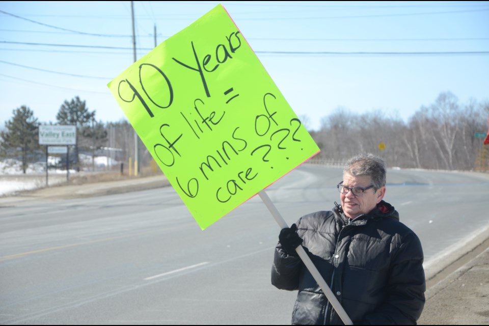 Members of Mine Mill Local 598/Unifor protest outside of the Elizabeth Centre in Val Caron on Friday afternoon. The union is seeking minimum staffing standards that would allow PSWs to commit four hours per resident per day in long-term care homes. (Arron Pickard/Sudbury.com)
