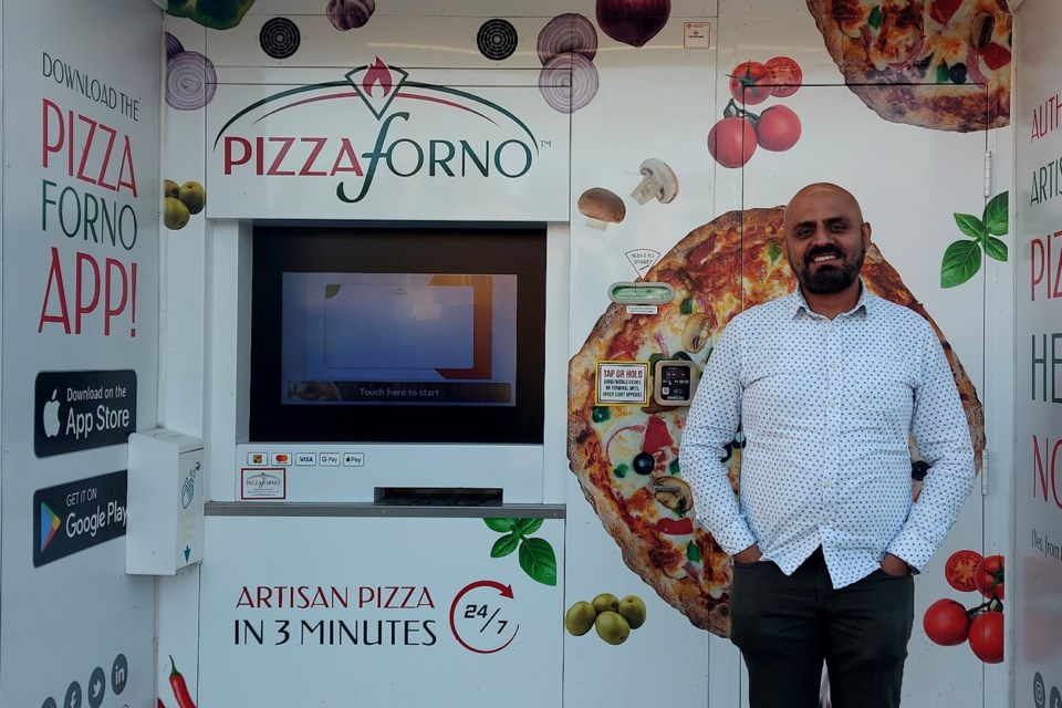 Amit Parmar stands in front of one of his Pizza Forno units. The units take orders, refrigerate pizza and heat up pizzas for customers in 3 minutes flat. This unit is located in Minnow Lake at the Kwik-Way. Parmar has five locations in total in the Sudbury limits.