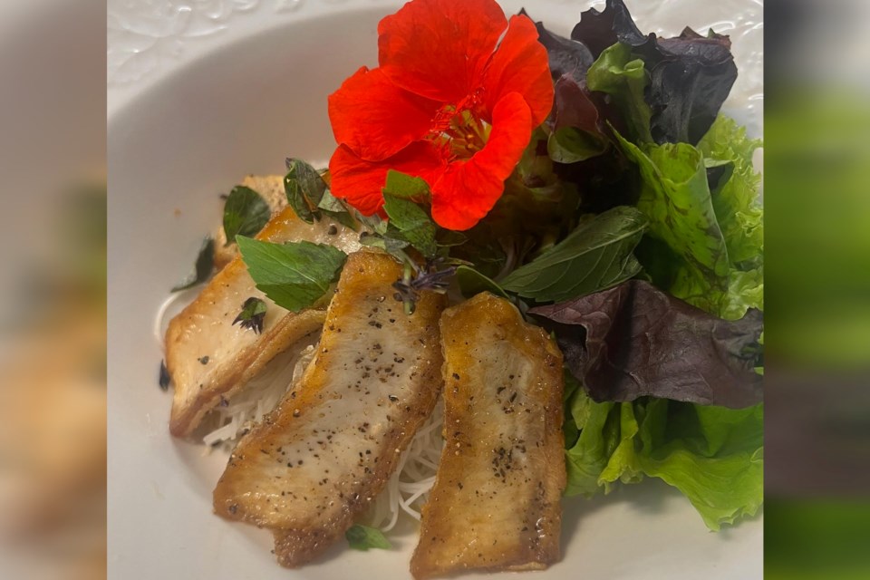 On the menu at the Garden’s Gate Restaurant in Tehkummah is a dish featuring local trout belly with rice noodles, house greens and a Vietnamese-style dressing. Many of the flowers at Garden’s Gate make for exquisite garnish on the dishes.