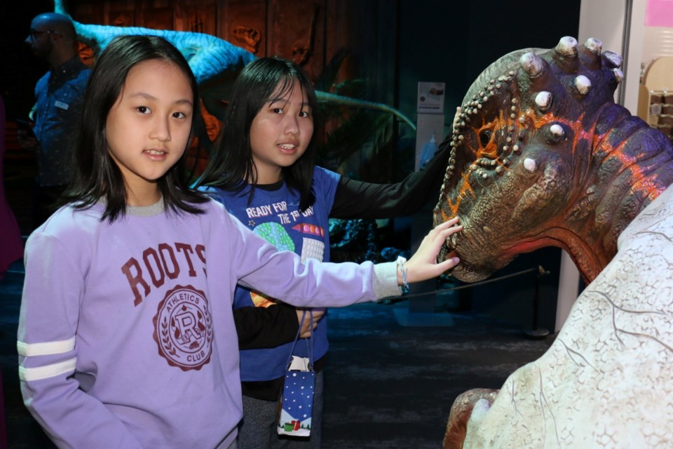 MacLeod Public School students Hannah Ruan, left, and Yiling Liu were among the first students to see the new Dinosaur Discoveries exhibit at Science North at its world premier on Feb. 17.