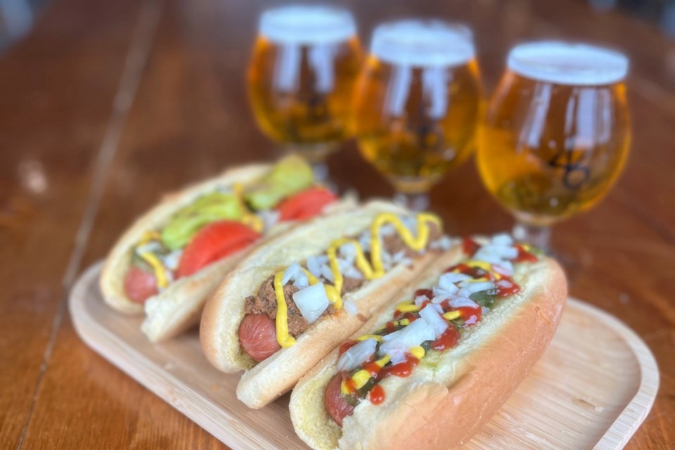 46 North Brewery has been pairing ale with hot diggity dawgs since 2022. The brewery always has four premium hotdogs on the menu along with four more standard ones. Co-owner Holli Bernier says she never strays from Coney Island, while her partner Graham Orser loves the Chicago, a hotdog covered with tomato, pepperoncini, pickles, relish, white onions, mustard and celery salt.