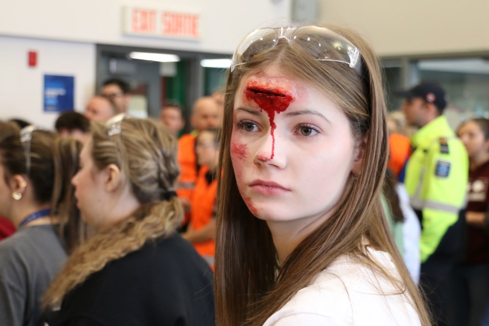 A student victim sports realistic fake injuries at Collège Boréal simulated emergency incident on April 16 2025