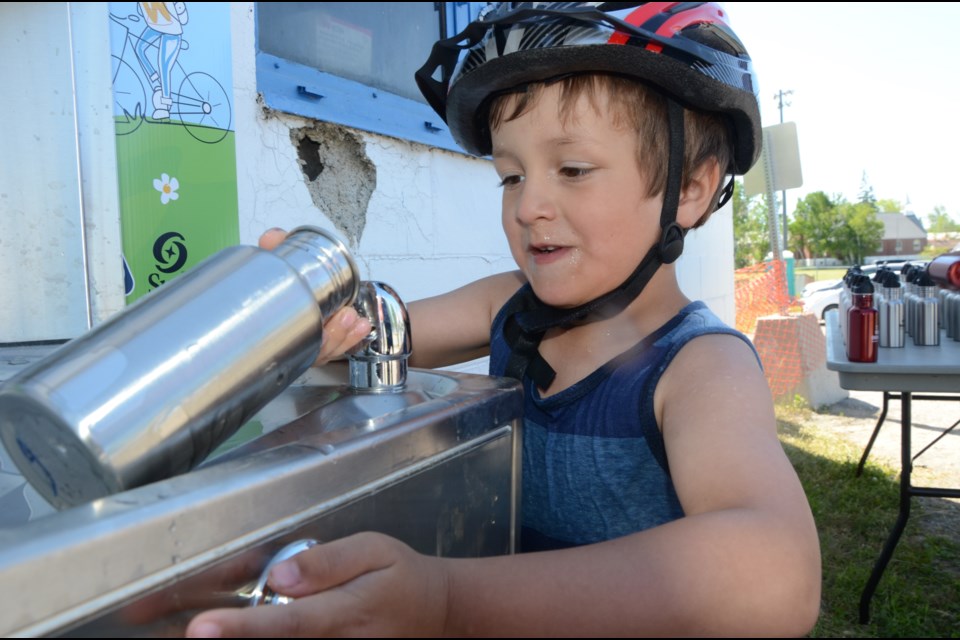 Bentley Sarazin, 5, fills a water bottle at the new filling station at Carmichael Arena on Friday during the launch of Phase 2 of the Healthy Kids Community Challenge. Similar filling stations will be installed at areas where kids meet and play throughout the city. Photo by Arron Pickard