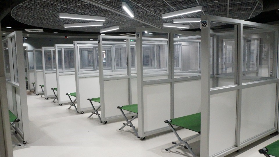 The cots are separated by dividers put in place due to the pandemic. Shelter-users are offered washing supplies as well as sheets and blankets.