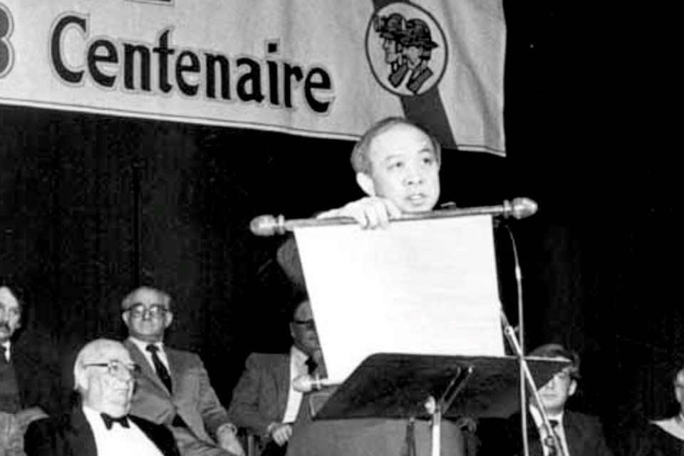 Mayor Peter Wong reads from a ceremonial scroll before a crowd of 5,000 people on New Year’s Day 1983 to open officially the city’s year-long centennial celebration. 