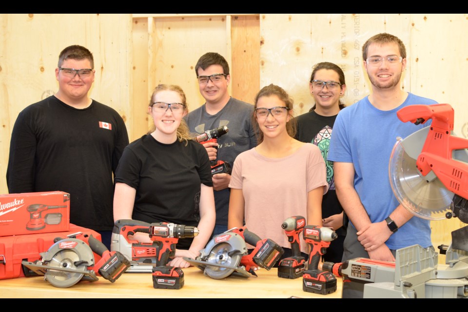 Thanks to the school's partnership with a summer camp in the region, Lockerby Composite School has earned provincial accolades. Students were recently named Community Builders by Skills Ontario and Milwaukee Tools. From left, Garrett Wisniewski, Dana Simeoni, Christian Rainville, Veronica Dynes, Brayden Martin and Colby Lindroos display the tools they received in the Milwaukee prize pack. (Supplied)
