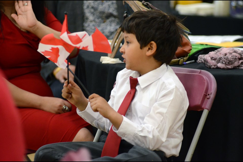 Adults and children alike were among the 49 people who took oaths as Canada's newest citizens on Thursday. Photo by Arron Pickard.
