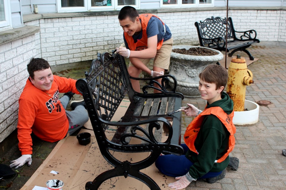 Grade 8 students with École St-Denis gave the grounds of the Walford retirement home in Greater Sudbury’s South End a facelift Thursday. From left are students Claude Dupuis, Costa Simon and Luca Cecchetto.