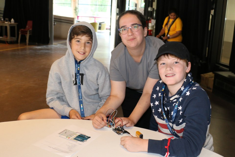 Students at Cambrian College were learning about electronic circuitry. From left to right are Miguel Nadeau, Cambrian technician Summer Desloges and student Ross Noble.