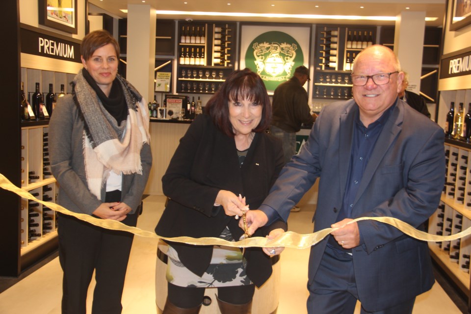 The ribbon was cut on the new Magnotta Winery retail location in Greater Sudbury Oct. 18. From left are Greater Sudbury Chamber of Commerce membership account manager Caroline Cameron, Magnotta Winery CEO Rossana Magnotta and Mayor Brian Bigger. (Heidi Ulrichsen/Sudbury.com)
