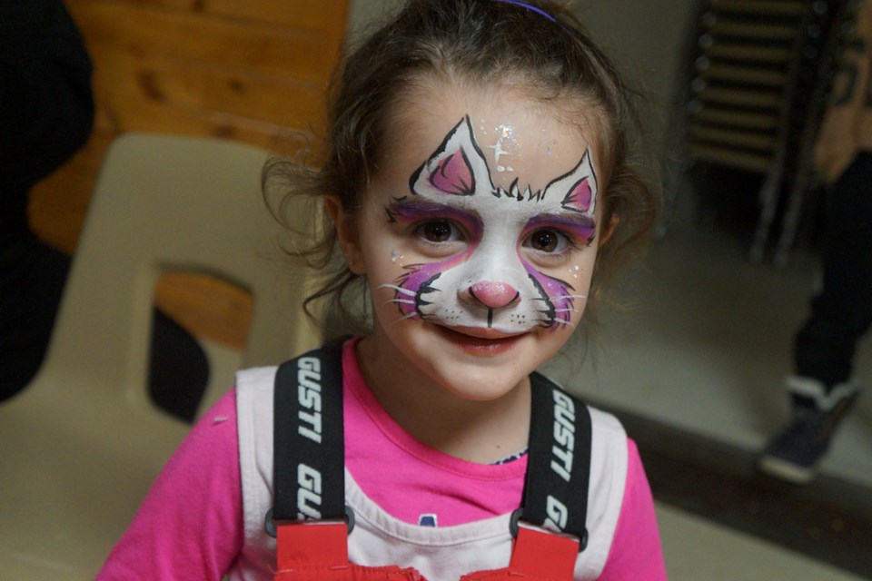 Sofia Priola, 2, shows off her face paint at the Valley East CAN Family Day celebration at Centennial Arena in Hanmer on Feb. 20.