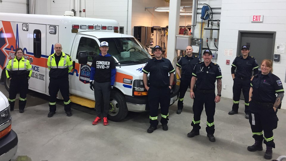  Blue Jays Central host Jamie Campbell with members of Cochrane District EMS in Timmins. (Supplied)
