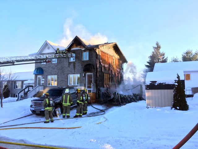 The Sudbury Professional Fire Fighters Association shared these photos of firefighters with the Greater Sudbury Fire Service battling a fire at a home on Benita Boulevard in New Sudbury. (SPFFA image)