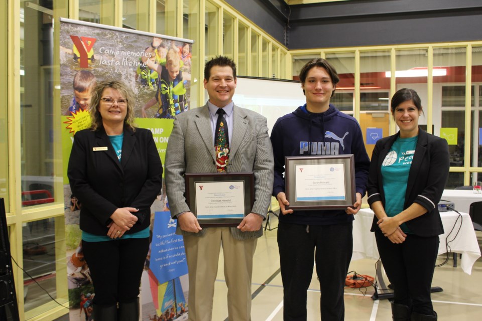 Manager of Children's Services and Peace Week 2018 Co-Chair Sherry Ricci with father-son Peace Medal Award winners Christian Howald, Soren Howald and Michelle Knutson at the YMCA Peace Week Peace Medal Ceremony on November 22, 2018. (Allana McDougall/Sudbury.com)