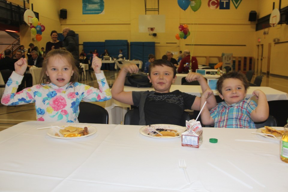 The Heckman kids (from left) Amara, 6, Amry, 8, and Amsden, 4, enjoyed the Strong Kids Campaign breakfast at YMCA Sudbury Thursday morning. Photo by Heidi Ulrichsen. 