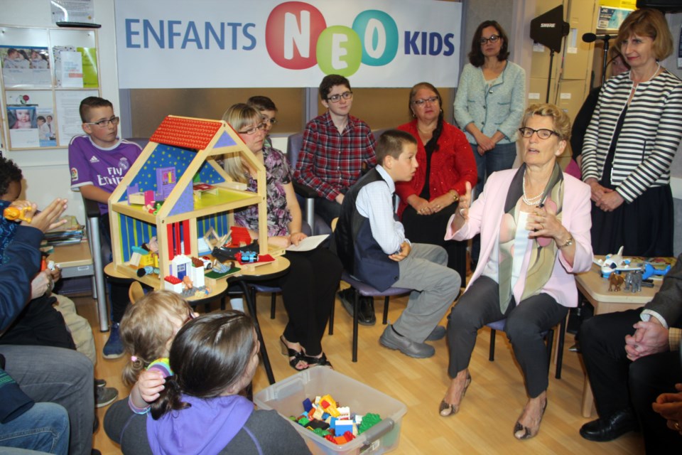 Premier Kathleen Wynne speaks to families who use NEO Kids Tuesday morning. (Heidi Ulrichsen/Sudbury.com)
