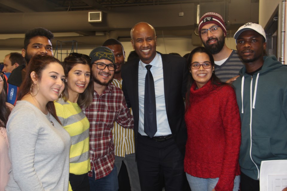 Ahmed Hussen, minister of Immigration, Refugees and Citizenship Canada, poses with Cambrian College international students Jan. 24. (Heidi Ulrichsen/Sudbury.com)