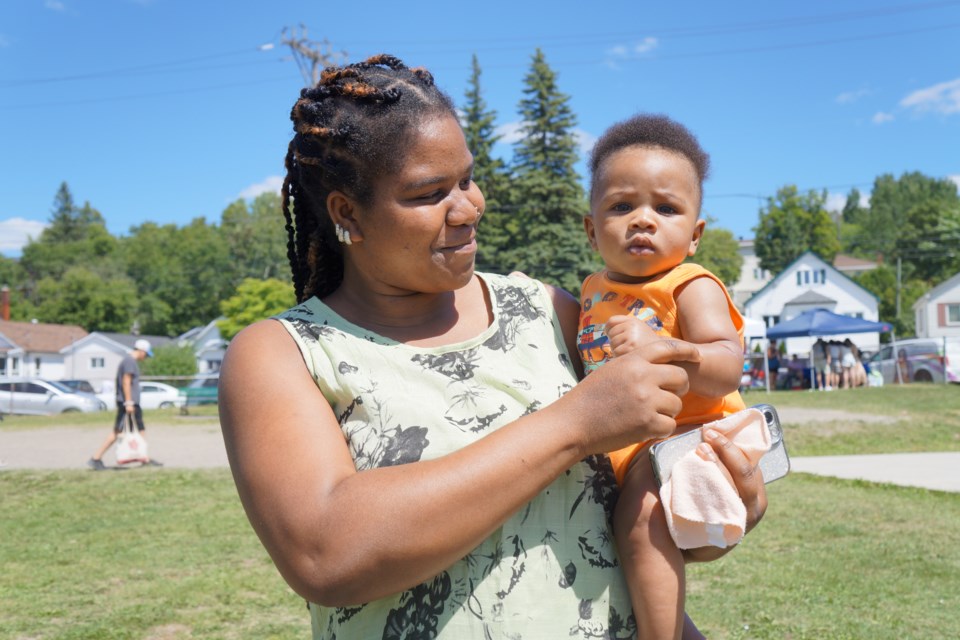 Lydia Ogbejiele brought little Lionel, six months, to the Better Beginnings Better Futures Family Summer Festival in Victory Park on July 22.