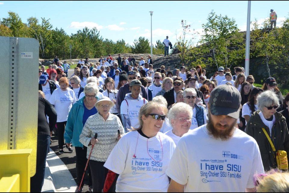 Students from Lasalle Secondary arrive at Finlandia Village after walking from their school. They were a big part of the first  Sling-Choker SISU Family Walk fundraiser on Saturday at Finlandia Village, helping to raise more than $40,000. Photo by Arron Pickard.