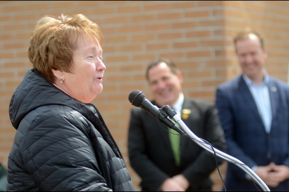 Former city councillor Evelyn Dutrisac speaks at the funding announcement from the federal government for a therapeutic pool at the Lionel E. Lalonde Centre as MPs Marc Serré and Paul Lefebvre look on. (File)