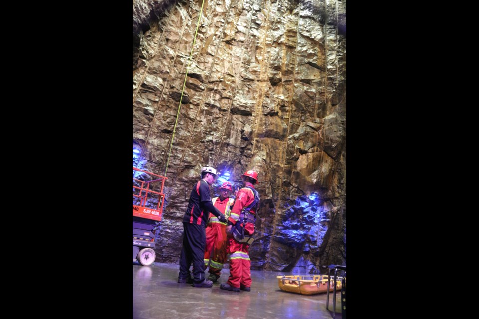 Jeff Farquharson rappelled  down the 70-foot, dripping rock wall at Dynamic Earth's Vale Chasm to rescue Perry Simon on Thursday morning as part of the rope rescue competition. Photo by Heather Green-Oliver.