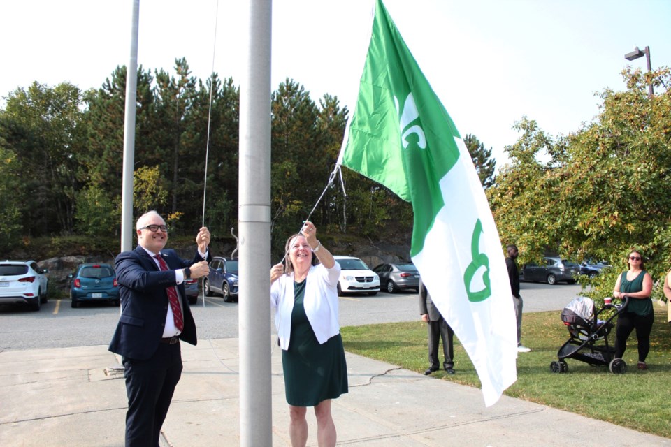 Université de Sudbury president Serge Miville and ACFO du Grand Sudbury president Joanne Gervais raise the Franco-Ontarian flag outside of the U of S Sept. 25.