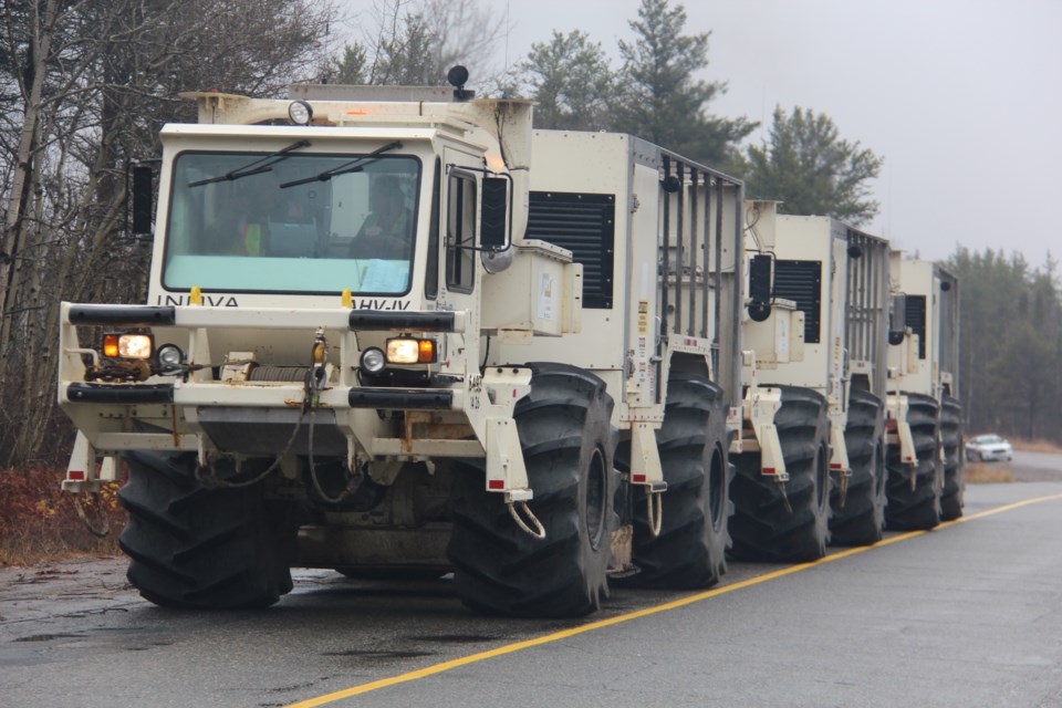 The convoy of seismic survey trucks maps a road in the Capreol area as part of Laurentian University's Metal Earth project. (Heidi Ulrichsen/Sudbury.com)
