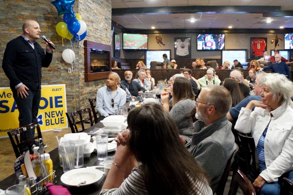 New Blue Party leader, Jim Karahalios, speaks to the crowd at his meet and greet event. 