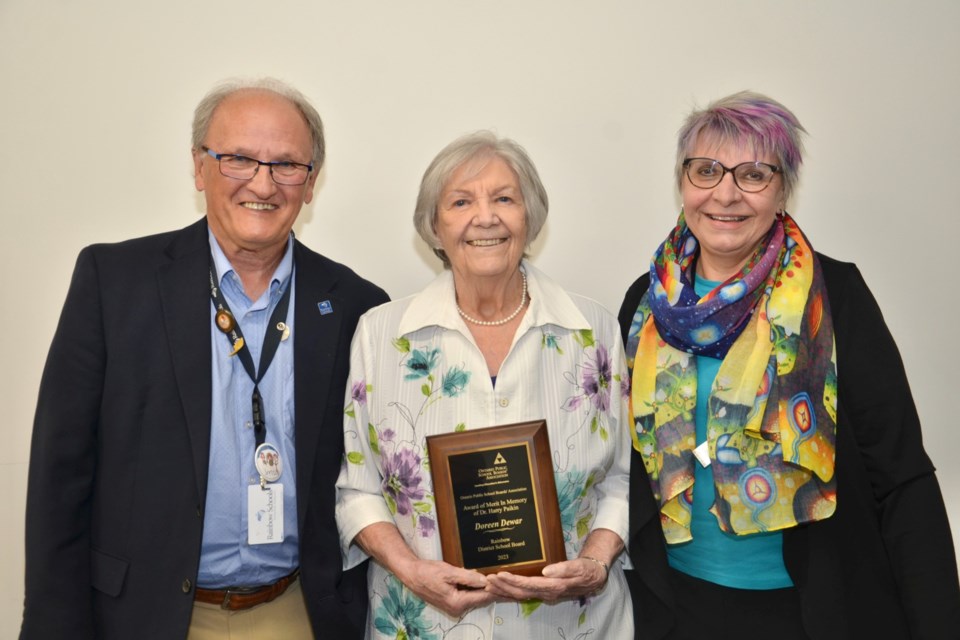 Rainbow District School Board Chair Bob Clement and Trustee Judy Kosmerly congratulate long-time Trustee Doreen Dewar on receiving the Dr. Harry Paiken Award of Merit from the Ontario Public School Boards’ Association. 