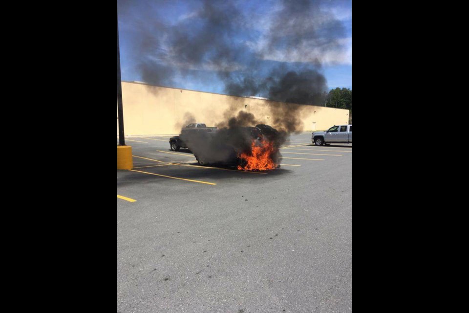 Robby Lavoie snapped this shot of a car fire at the South End Walmart Tuesday afternoon. (Robby Lavoie/Facebook)