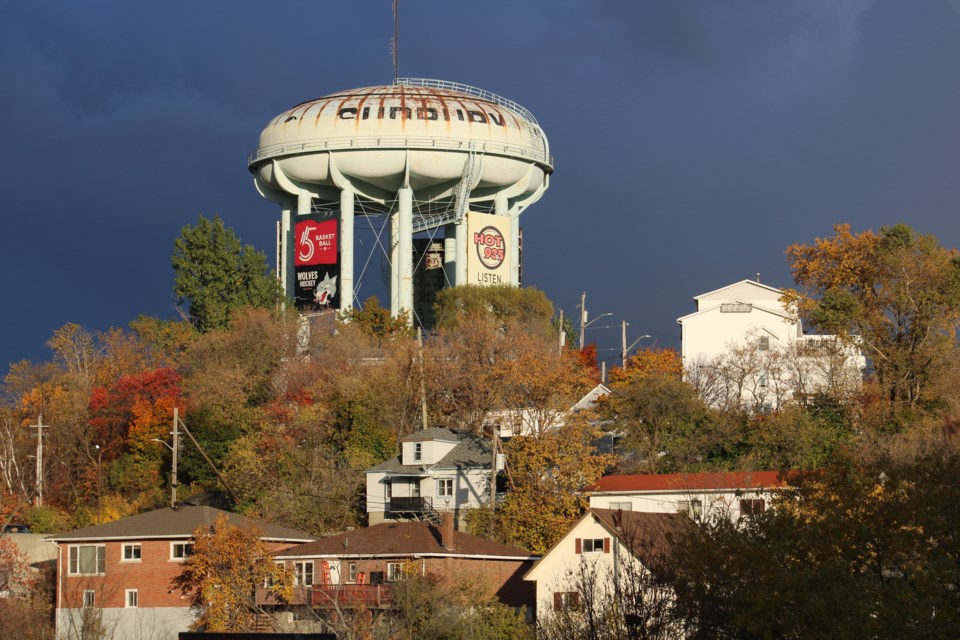 A range of housing is seen around the water tower overlooking downtown Sudbury.