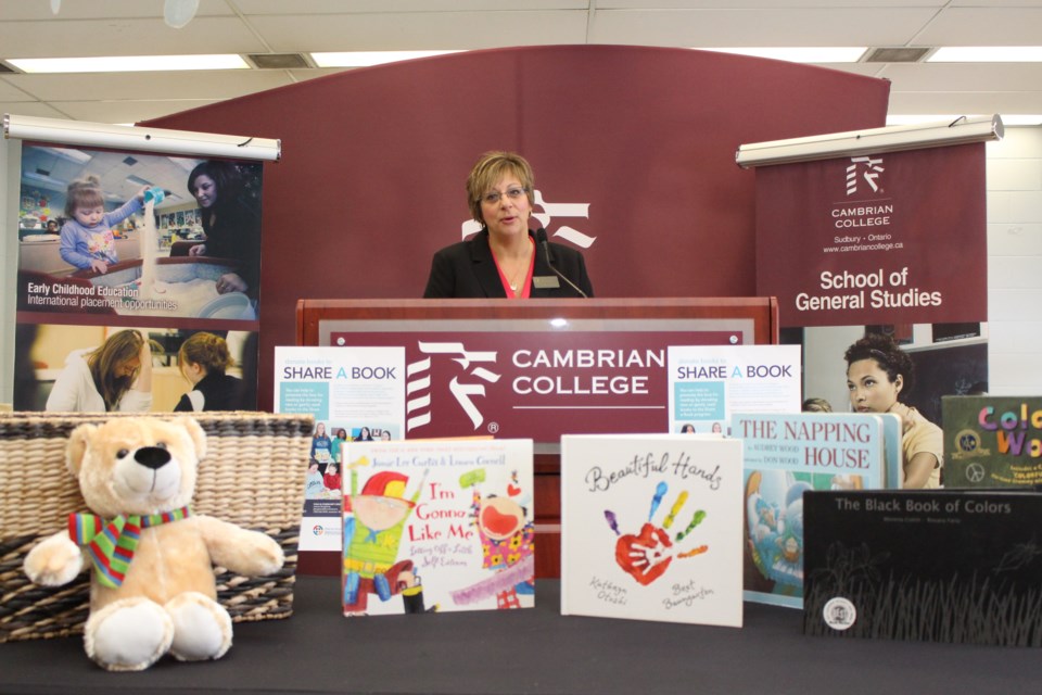 Emily Matheson, a professor with Cambrian College's Early Childhood Education and Upgrading program, speaks during the launch of the Share a Book campaign on Jan. 27. Photo by Arron Pickard.