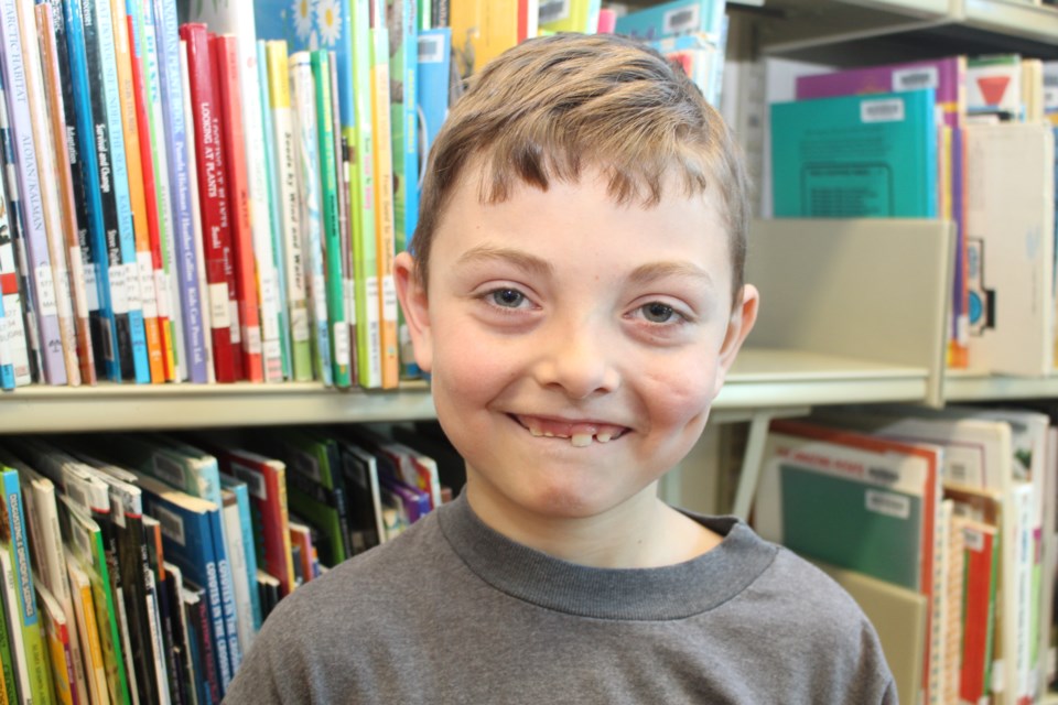 Justin Burnham, 9, and his four siblings have benefited from the province's Healthy Smiles program which helps families access dental care. Photo: Jonathan Migneault