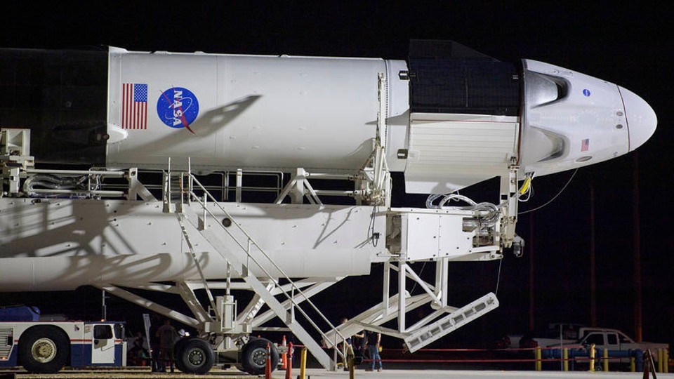 The SpaceX Dragon Crew capsule mounted on the Falcon 9 rocket taxis to the launch pad. (Image: NASA)