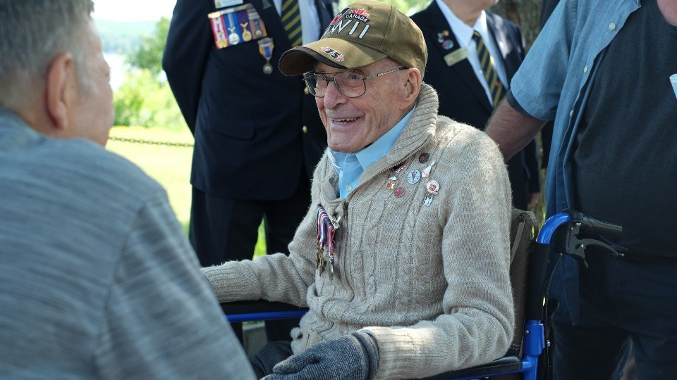 Second World War veteran Alfred Cyr smiles as he talks to one of the people attending the Quilt of Valour presentation ceremony.