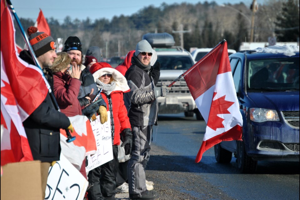 Supporters cheer on the Convoy to Ottawa 2022 at Jeremy’s Truck Stop at Nairn Centre west of Sudbury last month.
