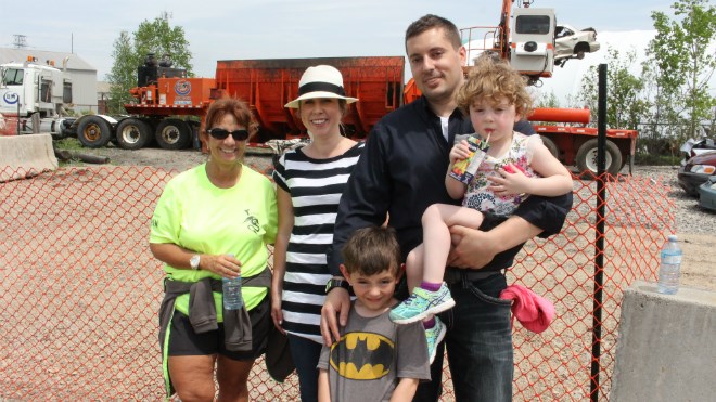 Tannys Loughren, executive director of the Northern Cancer Foundation, attended a car crushing event part of the month-long Scrap Cancer fundraiser with BM Metals’ Christine Harvey and Shayne Smith. Smith brought his daughter Adelaine, 3, and son Declan, 5, along for the event. Photo by Jonathan Migneault. 