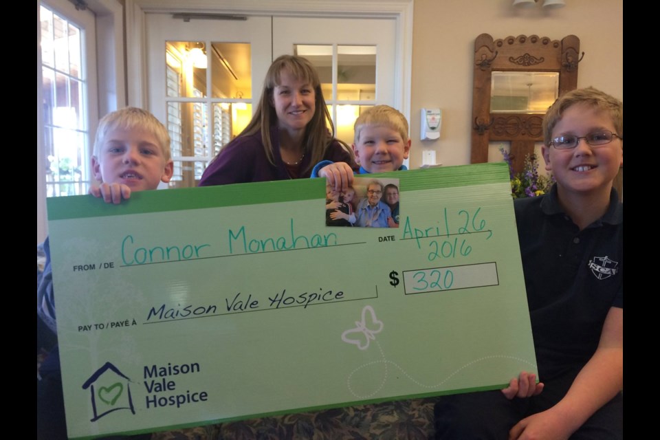 Seven-year-old Connor Monahan, seen here with his family members, recently donated $320 to Maison Vale Hospice in his Great Aunt Bea's name. Supplied photo.
