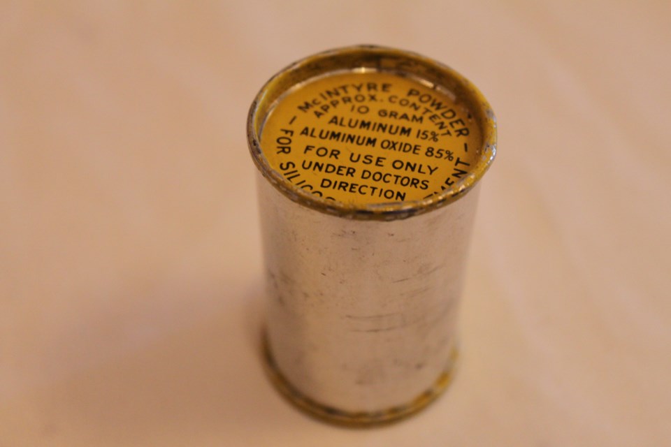 The directives on a canister of McIntyre Powder indicate it should only be administered under a doctor’s supervision, but miners say they never consulted with a physician before being forced to inhale the aluminum dust. Photo: Lindsay Kelly